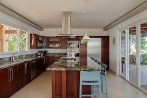 Private kitchen - Beach front villa surrounded by ocean views, steps from the beach (Playa Flamingo)