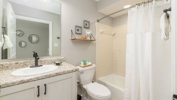 Combined shower/tub, hair dryer, towels, toilet paper