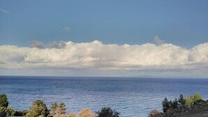 A coastal view with a clear sky and ocean. - Luxury fiore suites 3 (Zakinthos)