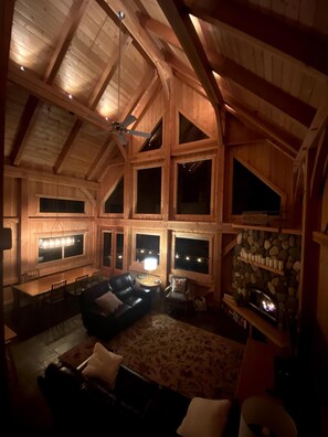 Tall ceilings and warm lighting at night