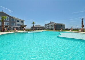 A heated pool, sun loungers