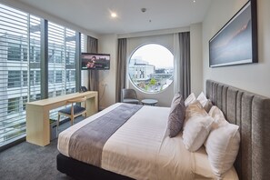 Executive Studio, 1 King Bed, City View | Minibar, desk, laptop workspace, blackout curtains