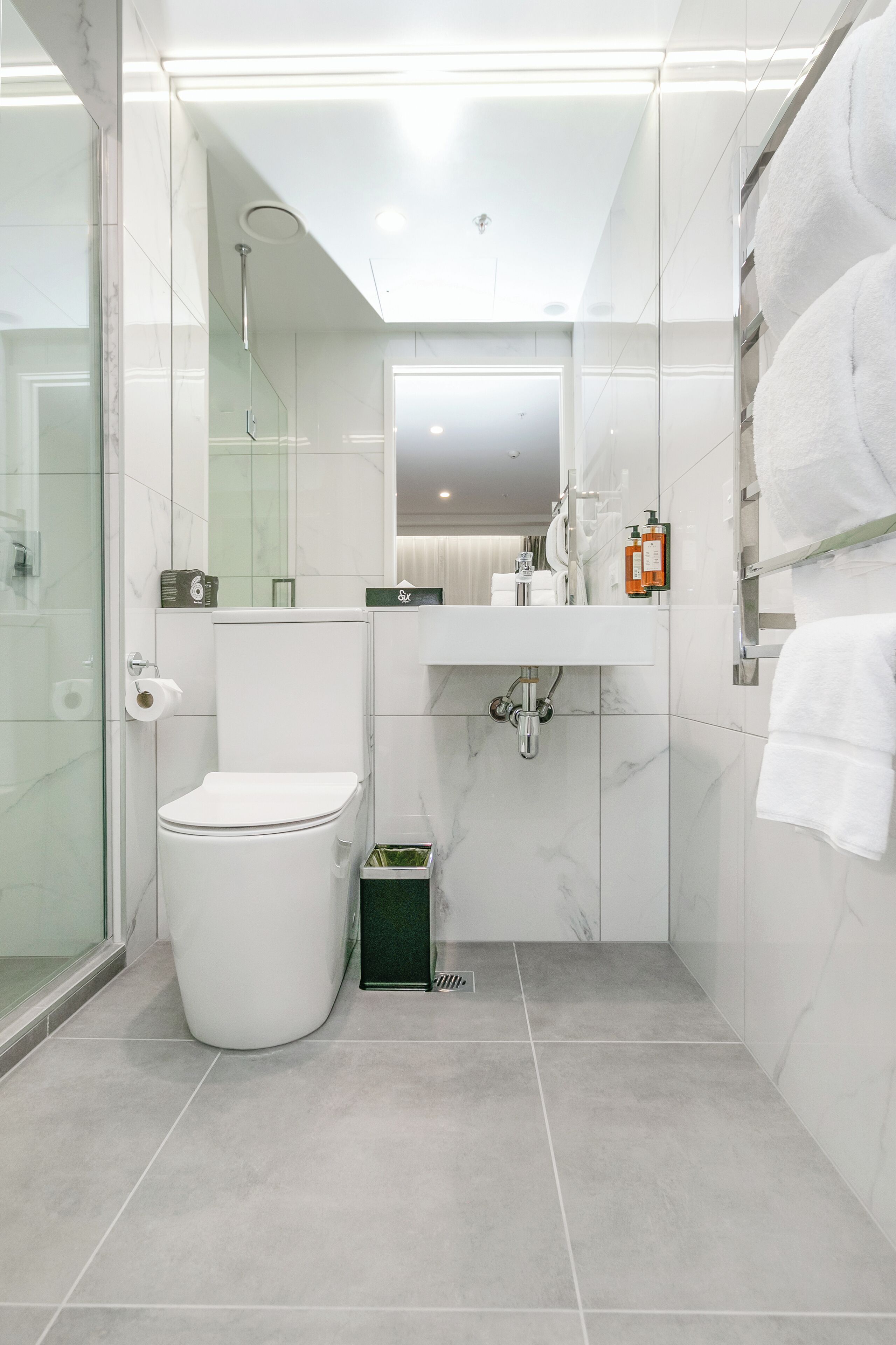 city room, 1 king bed, no windows | bathroom | shower, eco-friendly toiletries, hair dryer, towels