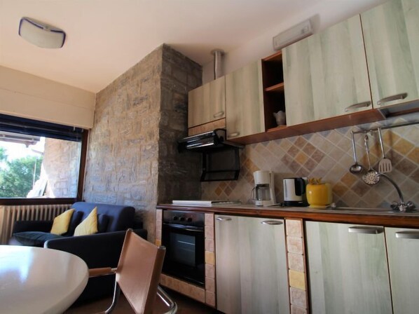 Fridge, oven, highchair, cookware/dishes/utensils