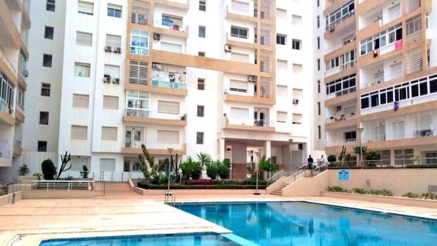 A residential building with a swimming pool, balconies, and a central courtyard. - Holiday residence Islane Agadir 4981 (Agadir)