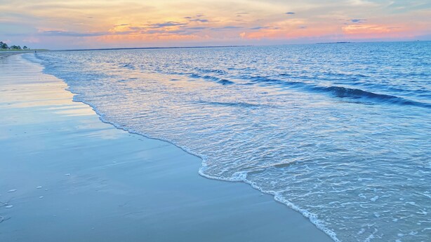 A beach with calm waves and a clear sky. - Hooked on Bayou? Waterfront! Kayaks, Fishing, Dock, The Views! (Carrabelle)
