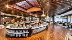 A spacious restaurant with a central buffet, wooden ceiling, and pendant lighting. - Vietsovpetro Dalat Hotel (Da Lat)