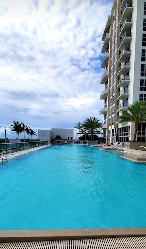 Outdoor pool, open 6:00 AM to 9:00 PM, free cabanas, pool umbrellas