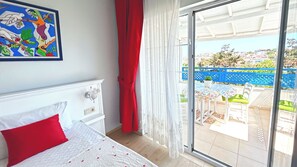 Quarto conforto | Frigobar, roupa de cama
