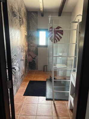 Shower, hair dryer, towels, toilet paper