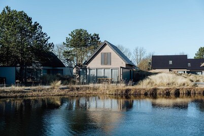 Enjoy all the extras of this vacation home, such as the wood-burning fireplace, wine refrigerator, and sun shower