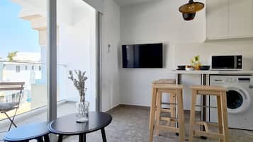 Luxury Studio | Living area | TV