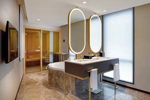A modern bathroom with a double sink, large mirrors, and a bathtub. - Wanda Vista Istanbul (Istanbul)