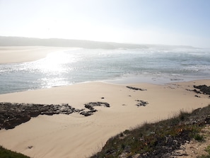 A beach with clear skies and calm waters.
