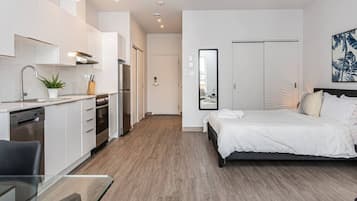 1 bedroom, desk, iron/ironing board, travel crib