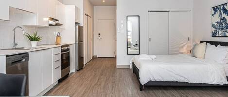 1 bedroom, desk, iron/ironing board, travel crib