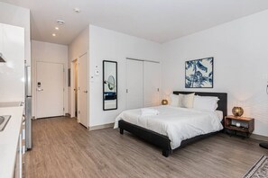 1 bedroom, desk, iron/ironing board, travel crib