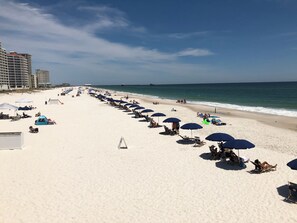 On the beach, sun-loungers
