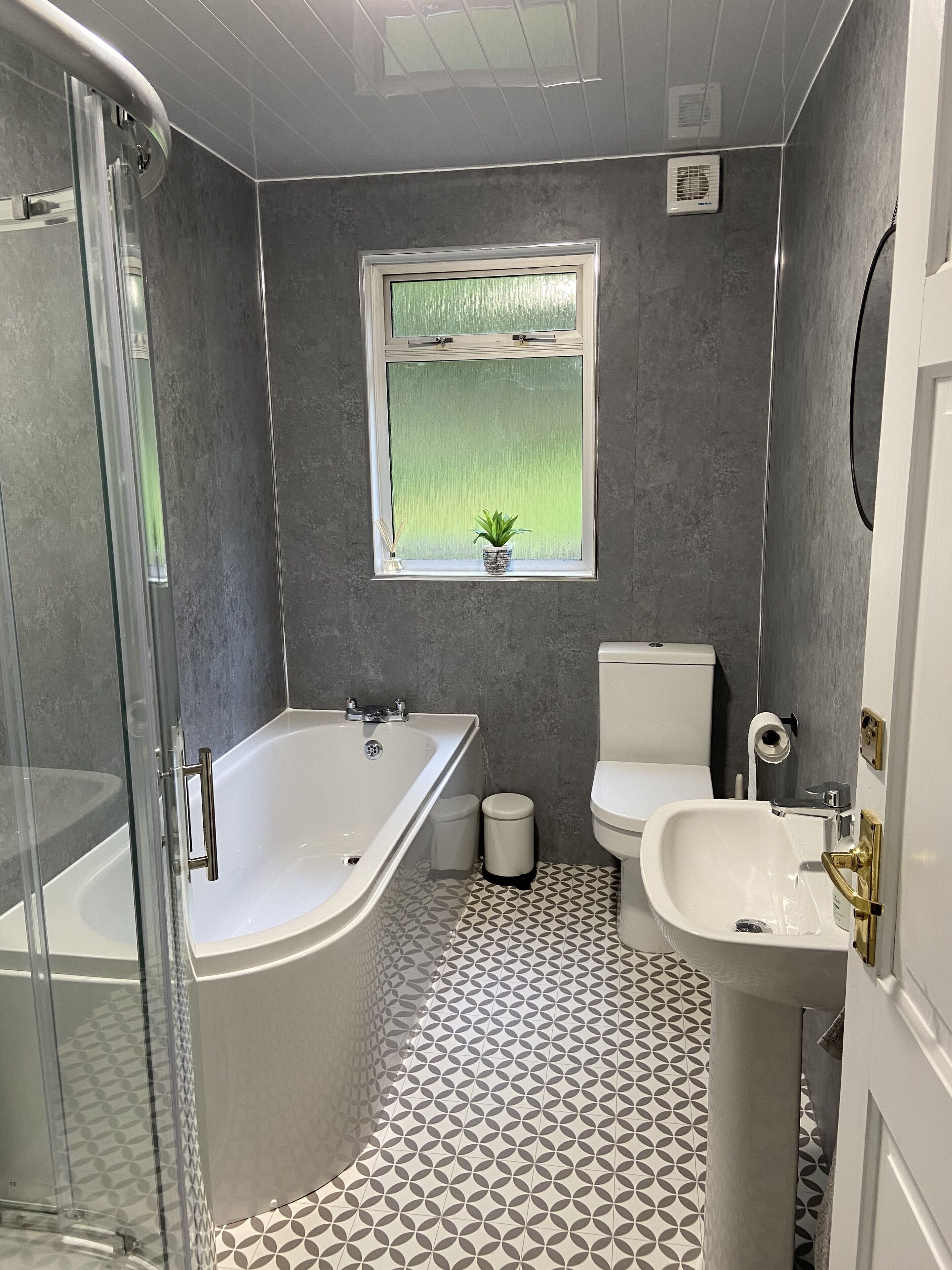 Bathtub, hair dryer, soap, shampoo
