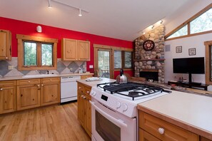 Enjoy cooking in the kitchen with a central island, gas stove, and oven.