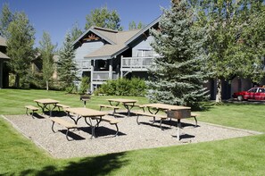 A building with a porch and outdoor seating area.
