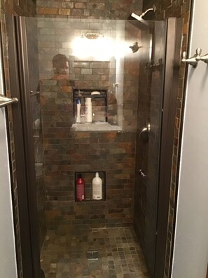 Shower, towels, soap, toilet paper
