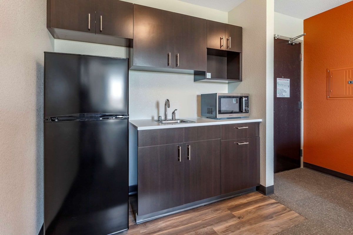 desk, laptop workspace, blackout curtains, iron/ironing board