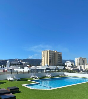 Outdoor pool, open 7:00 AM to 9:00 PM, pool umbrellas, sun loungers
