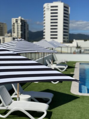 Outdoor pool, open 7:00 AM to 9:00 PM, pool umbrellas, sun loungers