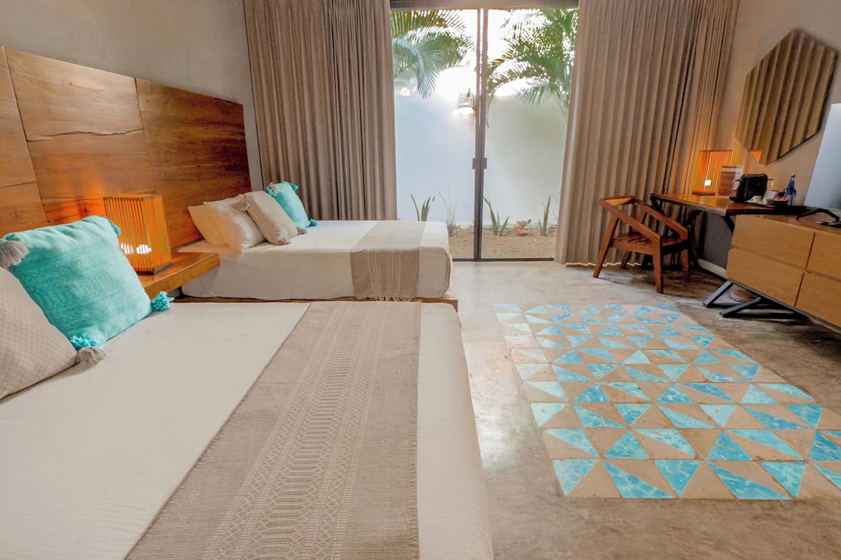 standard double room, 2 queen beds | 1 bedroom, premium bedding, in-room safe, blackout curtains