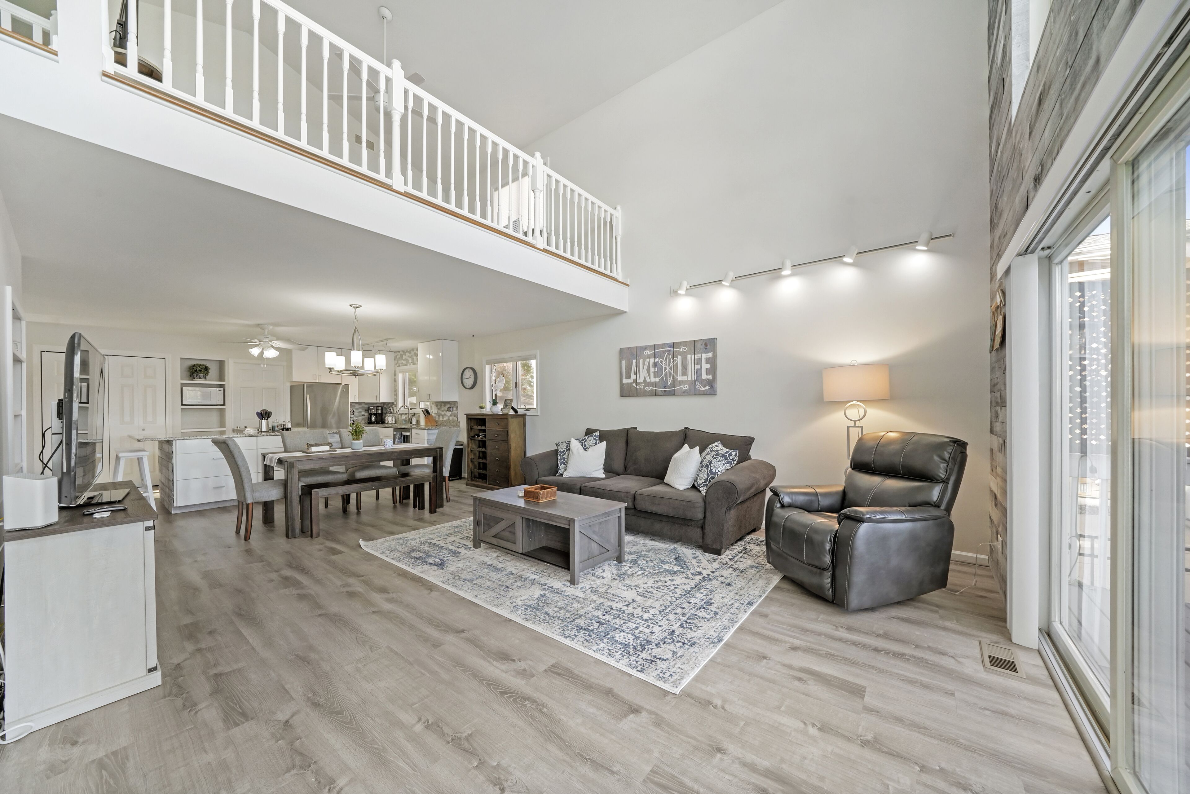 Large open living and dining area with a smart TV