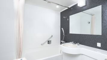Combined shower/tub, free toiletries, hair dryer, slippers