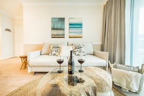 Premium Apartment | Living area | Flat-screen TV