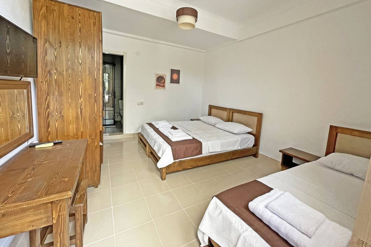 Standard Triple Room, Garden View | Minibar, free WiFi, bed sheets