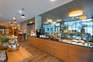 Breakfast, lunch, dinner served; international cuisine, garden views 