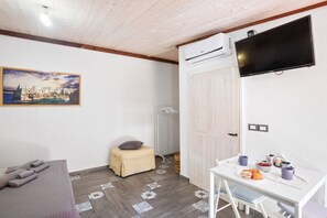 Fer et planche à repasser, draps fournis