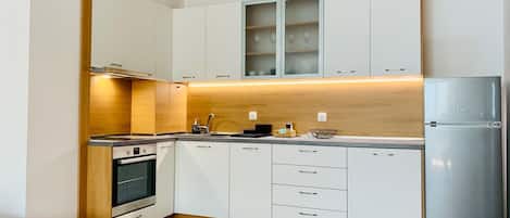 Grand Apartment | Private kitchen | Full-size fridge, microwave, oven, electric kettle