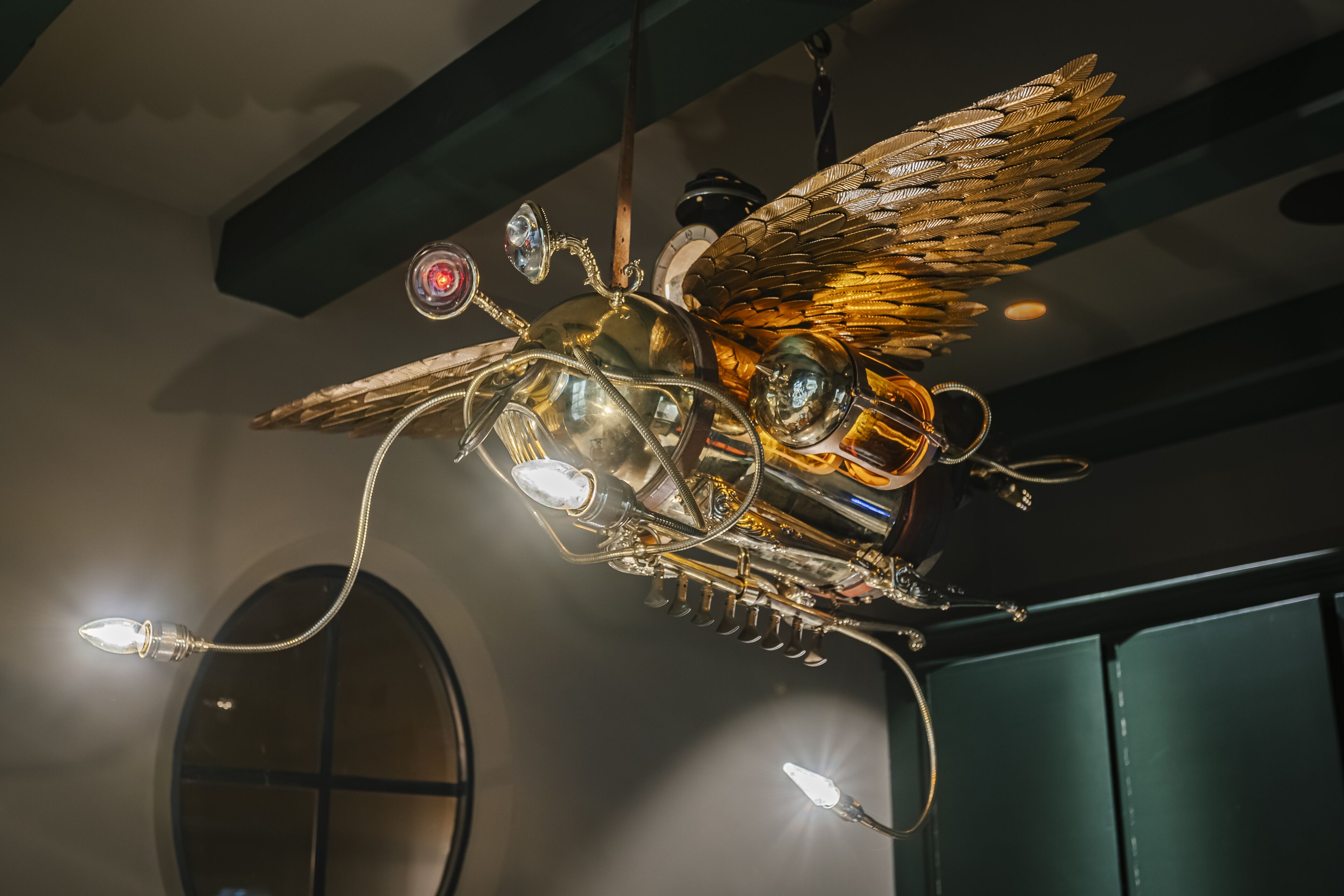 A chandelier with intricate metalwork and multiple light sources.