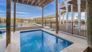 A covered swimming pool area with a view of a desert landscape. - THE OCEANFRONT GRAND RESORT: 17 BR Luxury with Unmatched Views+ALL THE AMENITIES (North Myrtle Beach)