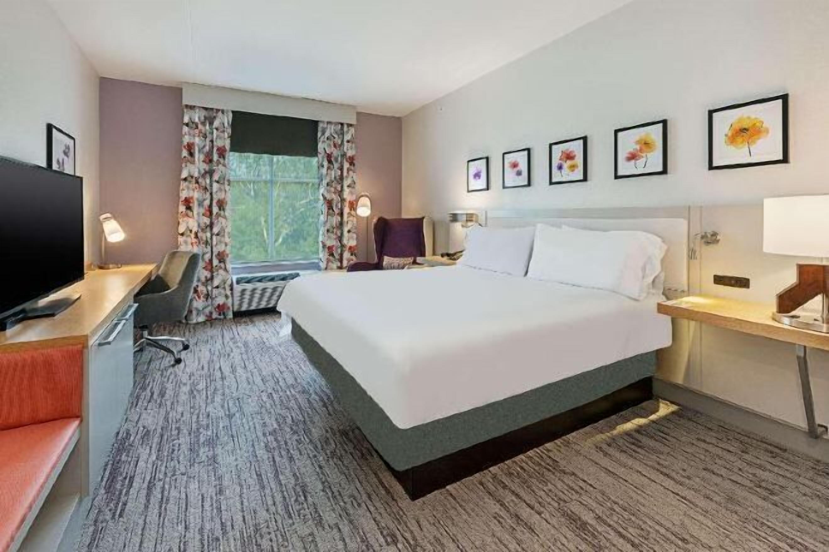 Desk, iron/ironing board, bed sheets