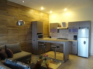 Comfort Apartment | Private kitchen | Full-size fridge, microwave, oven, stovetop