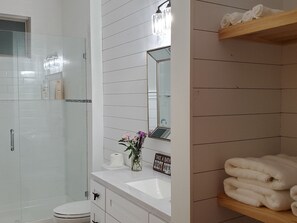 Shower, hair dryer, towels, soap