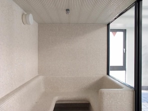 A small, tiled room with a window and a door. - Rhino (Kyoto)