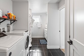 Combined shower/bathtub, hair dryer, towels, soap