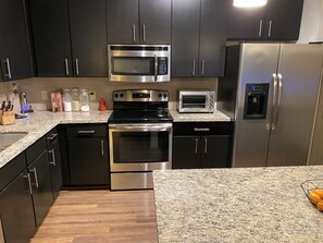 Microwave, dishwasher, cookware/dishes/utensils