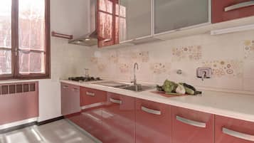 Fridge, electric kettle, cookware/dishes/utensils