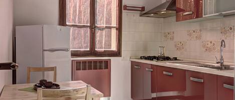 Fridge, electric kettle, cookware/dishes/utensils