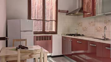 Fridge, electric kettle, cookware/dishes/utensils