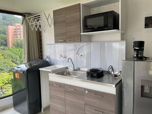 Microwave, coffee/tea maker, cookware/dishes/utensils