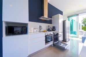 Villa | Private kitchen | Full-sized fridge, microwave, oven, stovetop